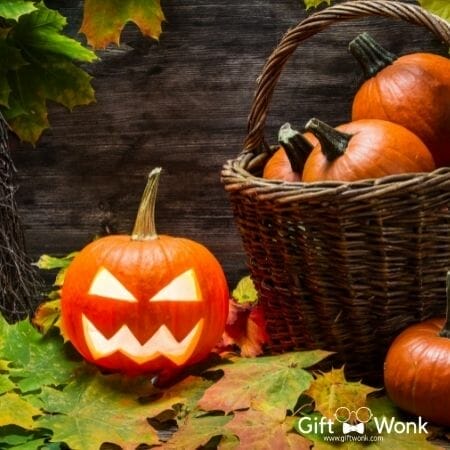 Halloween gift basket filled with pumpkins together with a jack o lantern