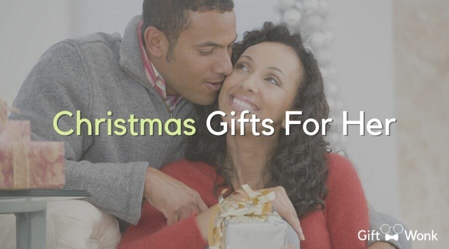 christmas gifts for her article title image with a sweet couple in the background 