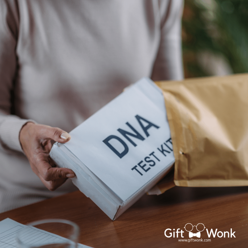 A picture of a woman holding a DNA test kit