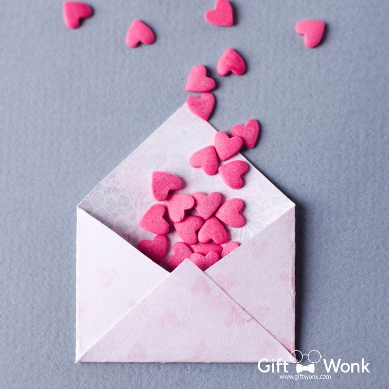An envelope filled with heart candies